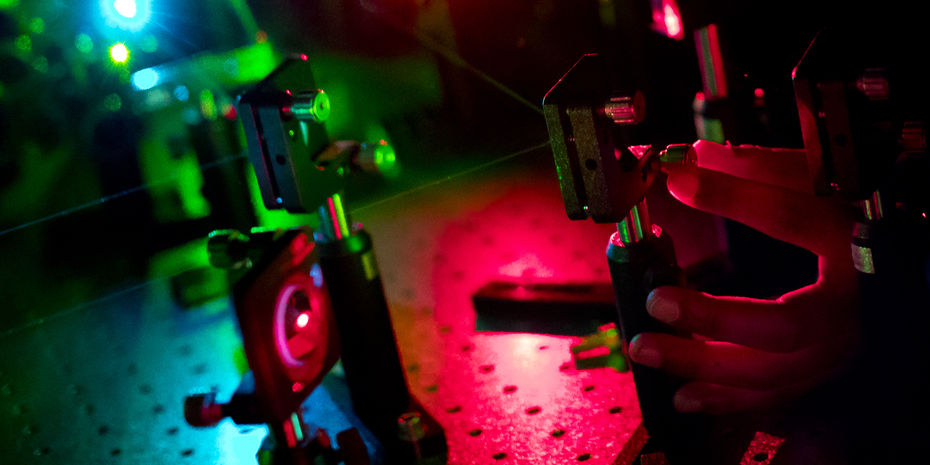 Researchers working in a laser lab.