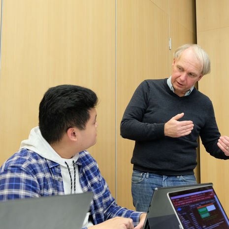 Professor Jonathan Smith and student in data science course