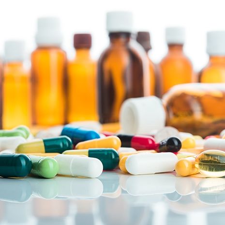 Bottles and pills on display. 