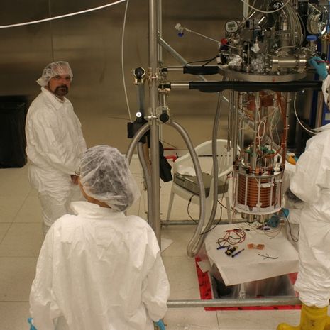 Physicist Jeff Martoff and fellow researchers in a lab