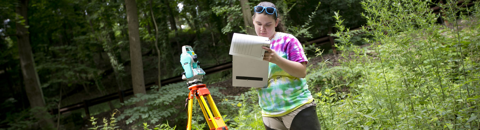 Environmental science student working in the field