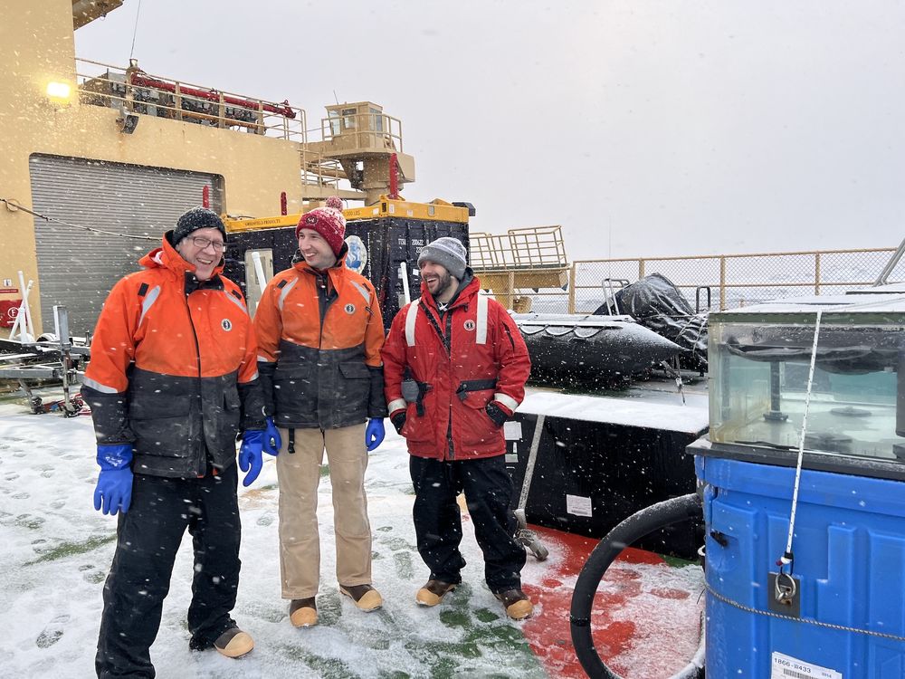 Bob Sanders, JayDiii Grattepanche and Chris Carnivale on the helo (helicopter) deck on the RVIB Palmer in Antarctica.