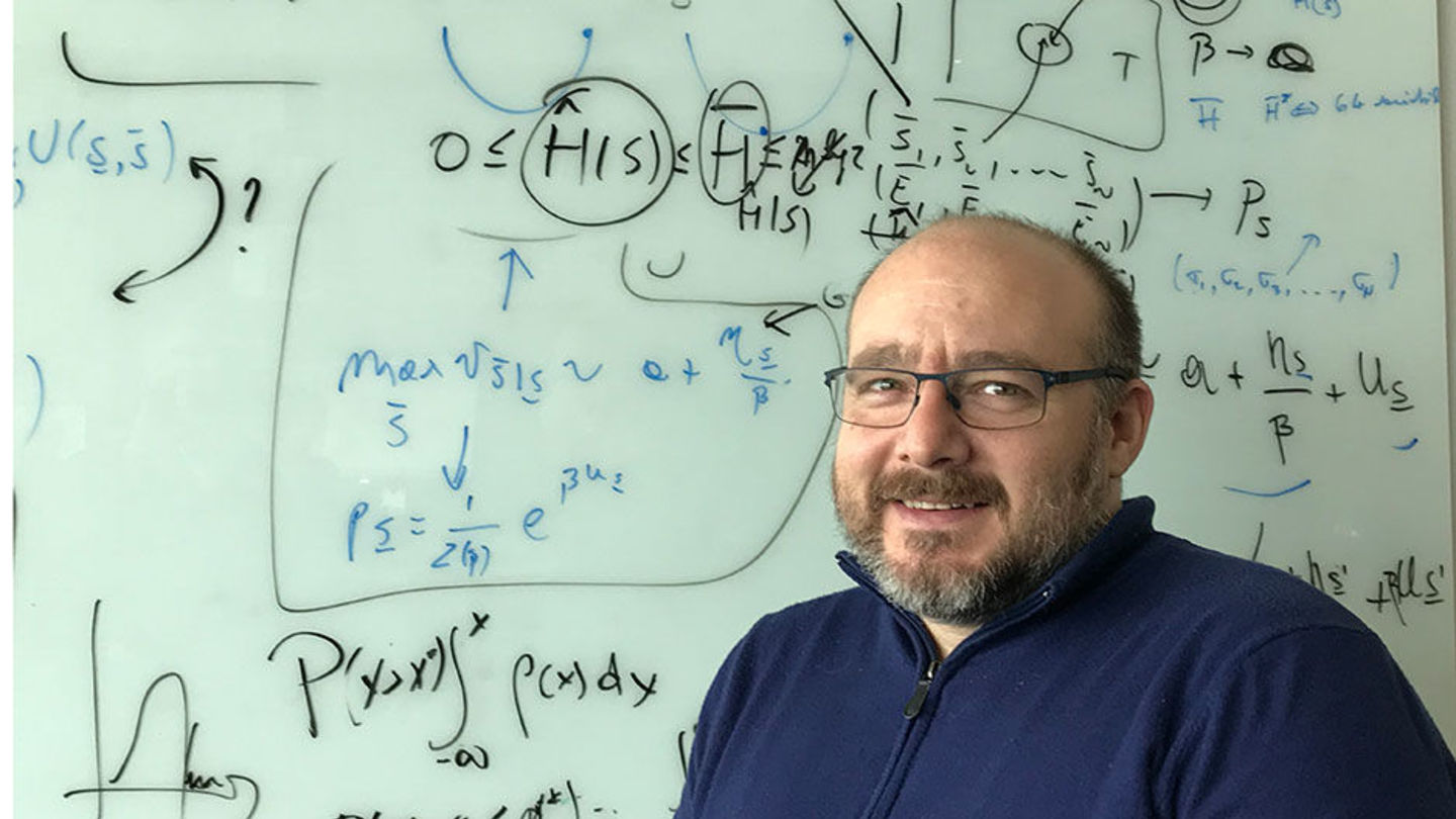 Associate Professor of Biology Vincenzo Carnevale is a co-principal investigator on a study of a potential new strategy for pain relief. Associate Professor of Biology Vincenzo Carnevale in front of white board with equations