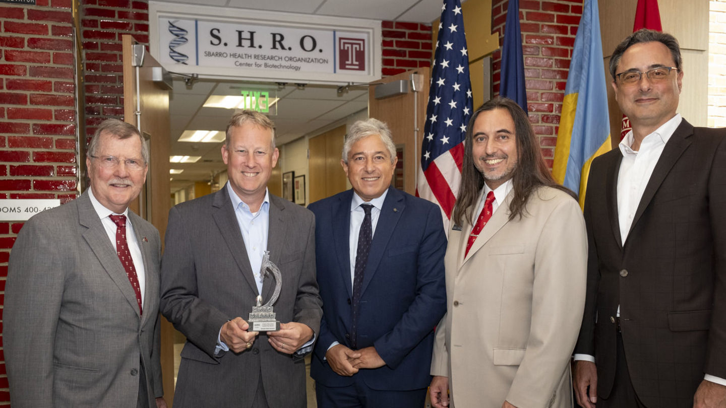 Pictured from left to right: Temple President Richard M. Englert; Sen. Ryan Aument (D-36); Antonio Giordano, founder and president of Sbarro Institute for Cancer Research and Molecular Medicine at Temple; Miguel Mostafá, dean of Temple’s College of Science and Technology; and Temple Provost Gregory N. Mandel. Image of men wearing suits during an award ceremony at Temple.
